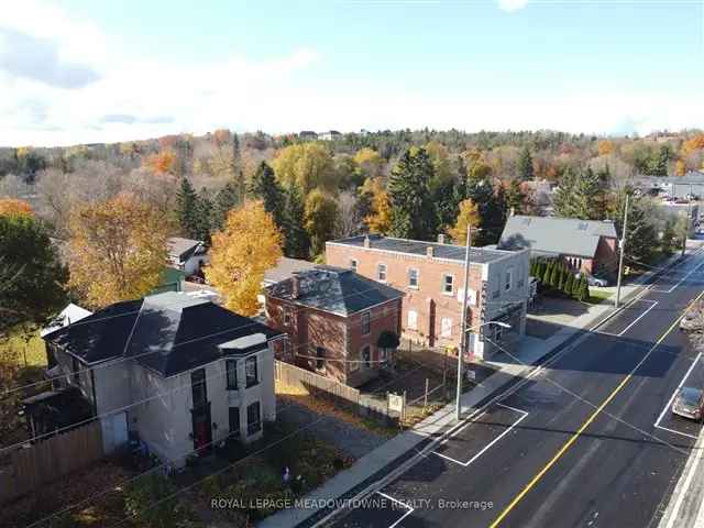 Century Brick Home with 5000 Sq Ft Outbuildings