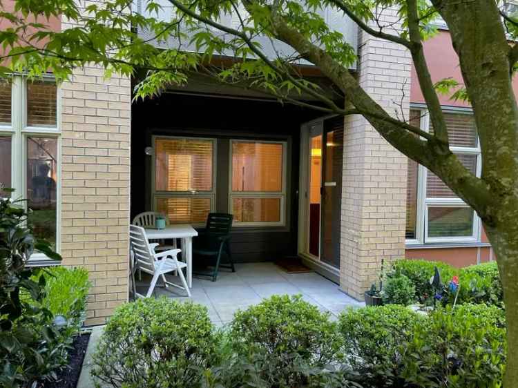 Ground floor buy home in Tsawwassen with private patio and green space