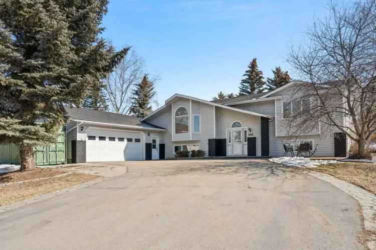 Spacious bi-level home for sale in Chestermere with lake access and garage