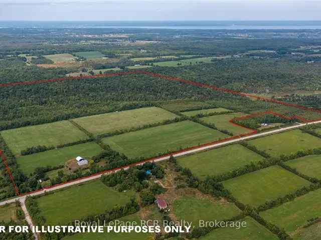 193 Acres with Farmhouse Barn Ravine and Road Frontage