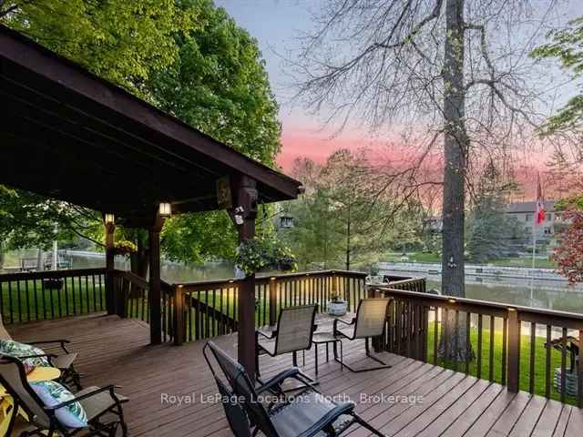 Riverfront Home with Wrap-Around Porch and High-End Retaining Wall