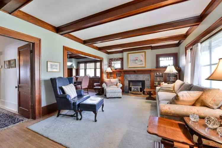 Elbow Park Gem: 1.5-Storey Home with Sunroom and Large Lot