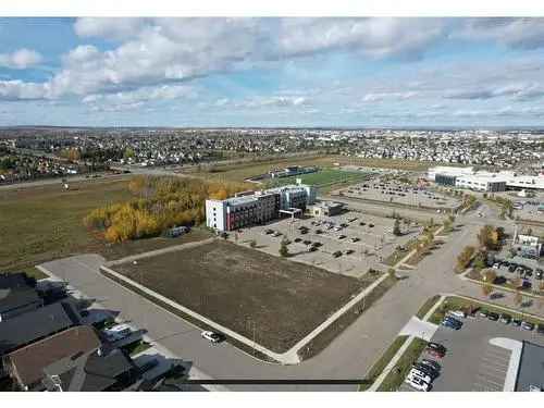 Buy Vacant Land in Grande Prairie with Prime Location and Zoning Potential