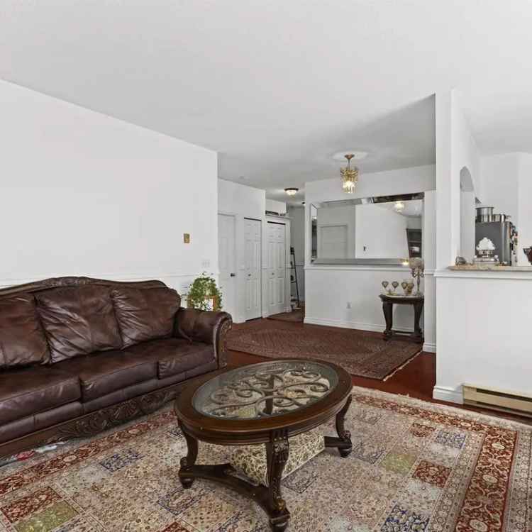 Central Lonsdale Renovated Ground Floor Unit with 750 Sq Ft Patio