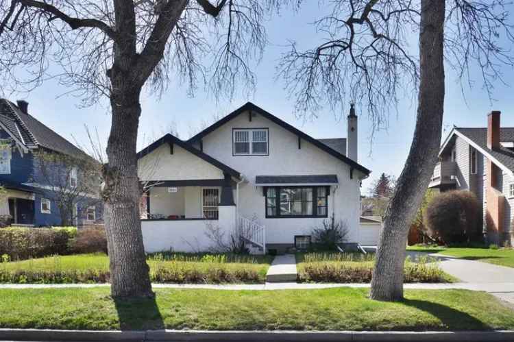 Elbow Park Gem: 1.5-Storey Home with Sunroom and Large Lot