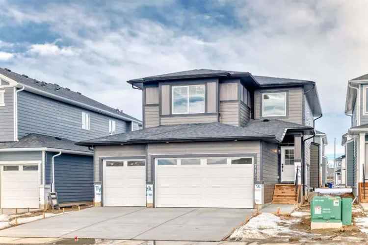 Luxury buy home in Carstairs Alberta with triple garage and flexible layout