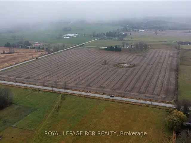 Custom Stone Bungalow on 50 Acres with Shop & Barns