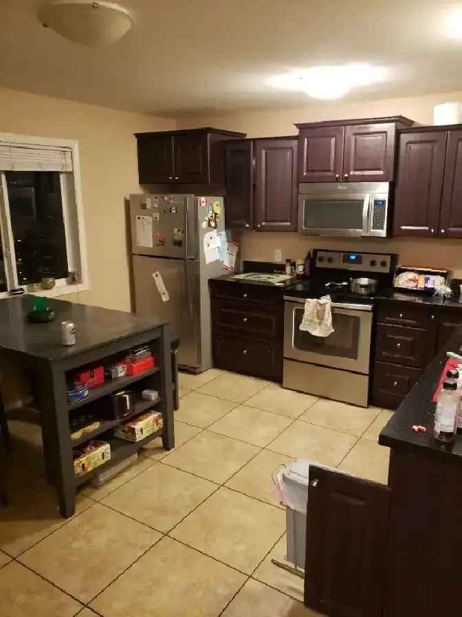 Room for rent in shared townhouse condo