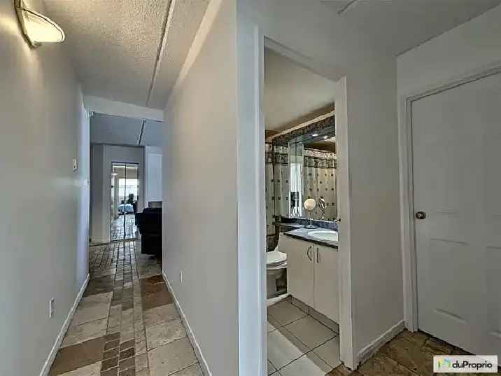 Aylmer Condo: Renovated 2-Bedroom with In-Unit Laundry and Balcony