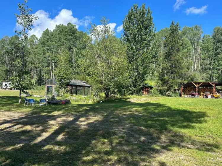 414 Acres on 3 Titles with Log Home, Cabins and 1.5 Miles of River Frontage - Fort Fraser, BC