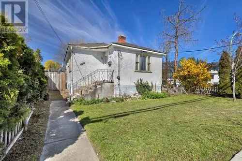 Kelowna Investment Property: 2 Bed, 1 Bath Home with Development Potential