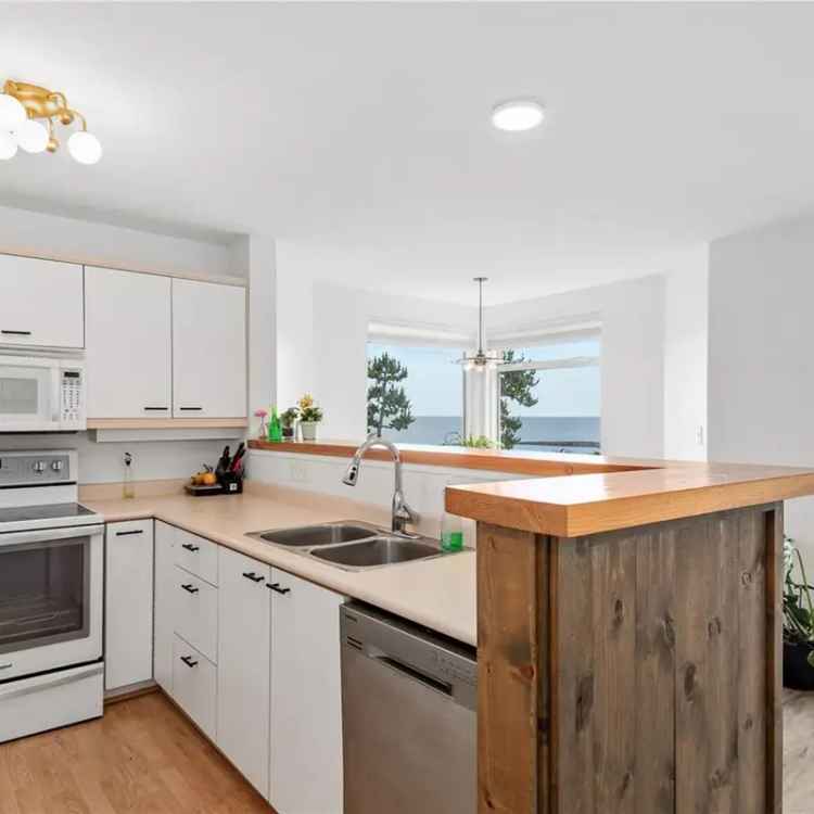 Apartment for sale in Whaler building with ocean views and private patio