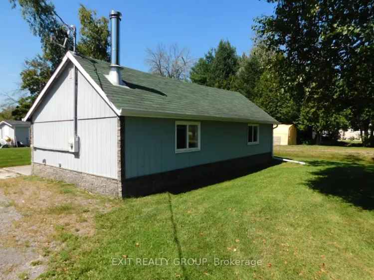 Waterfront buy property in Tweed with cozy cottage and garage