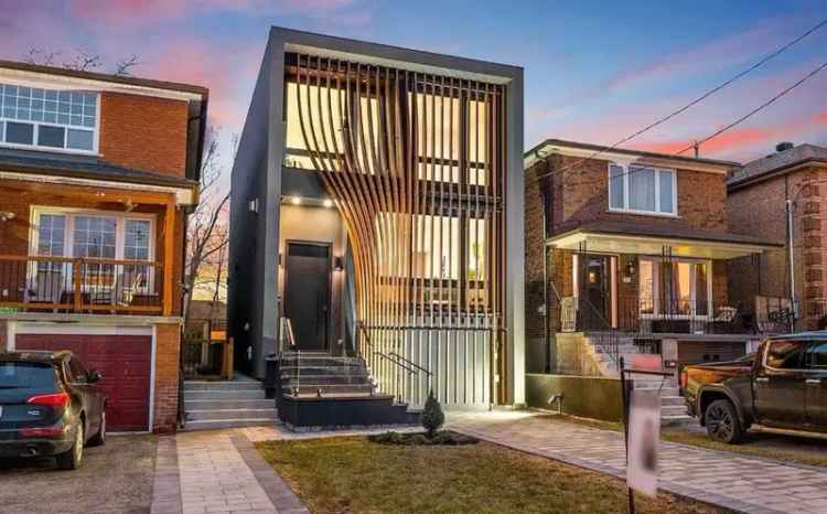 This Toronto House Has a Motorized Wood Facade That Opens and Closes