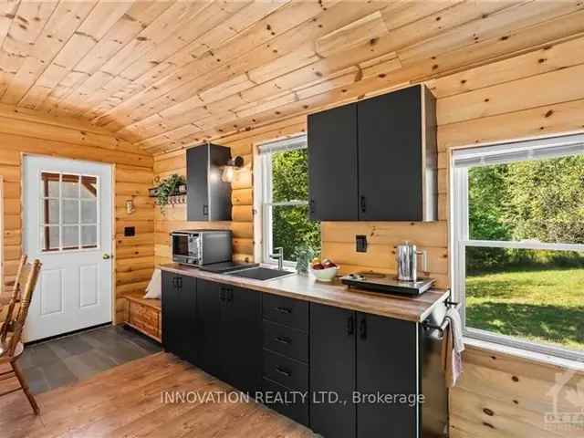 30-Acre Lakefront Oasis with Two Cabins and Deeded Access