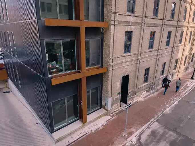 Buy historic building in Winnipeg with rooftop patio and natural light