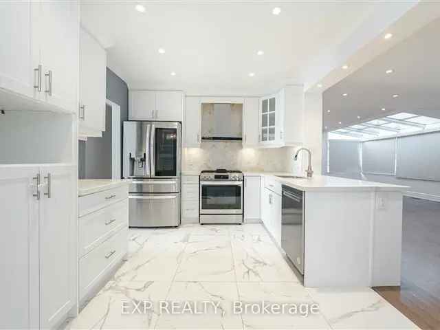 Stunning Renovated Bungalow with Sunroom Family Room and Bachelor Unit