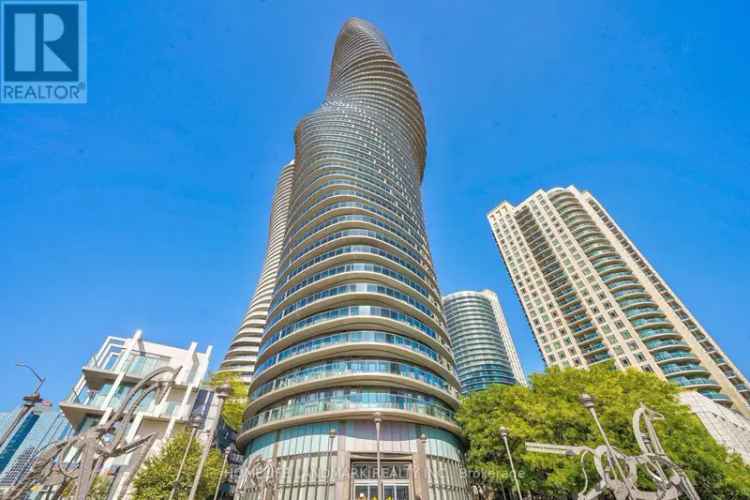 Spacious 1-Bedroom Condo Near Square One with Balcony and Lake Views