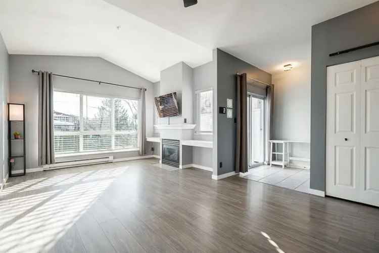 Spacious Top Floor Condo with 2 Patios and Low Strata