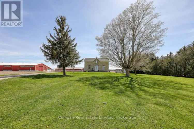 100 Acre Farm with Renovated Brick Home and Extensive Barn Complex