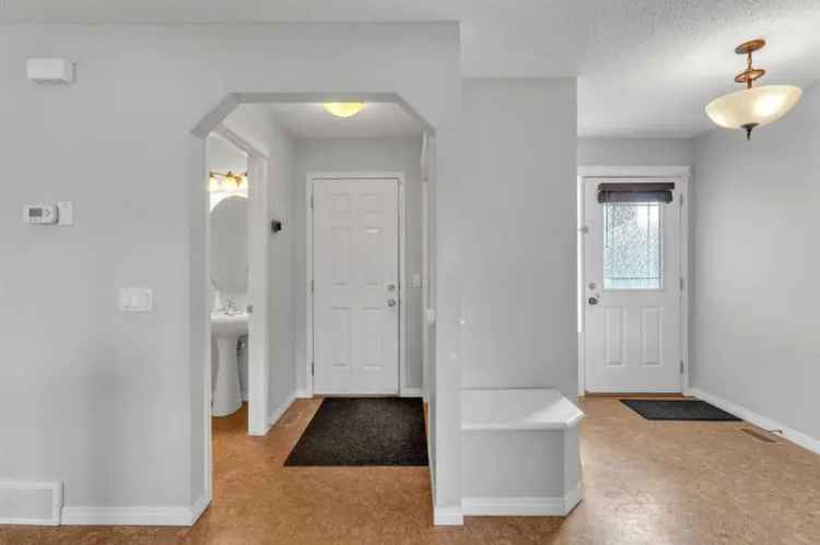 Buy 4 Bedroom House in Airdrie with Spacious Lot and Family Amenities