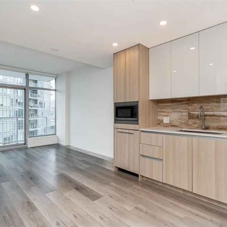 Luxury 1 Bed + Den Condo at Triomphe by Millennium