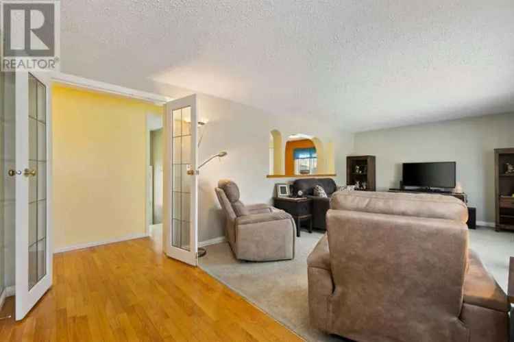 Buy house in Airdrie with charming features and a peaceful cul-de-sac