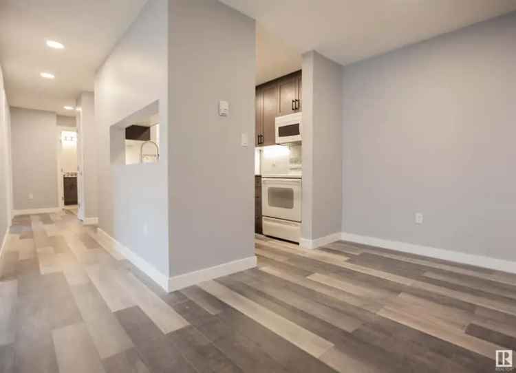 Buy condo in Mill Woods Town Centre with renovated kitchen and low fees