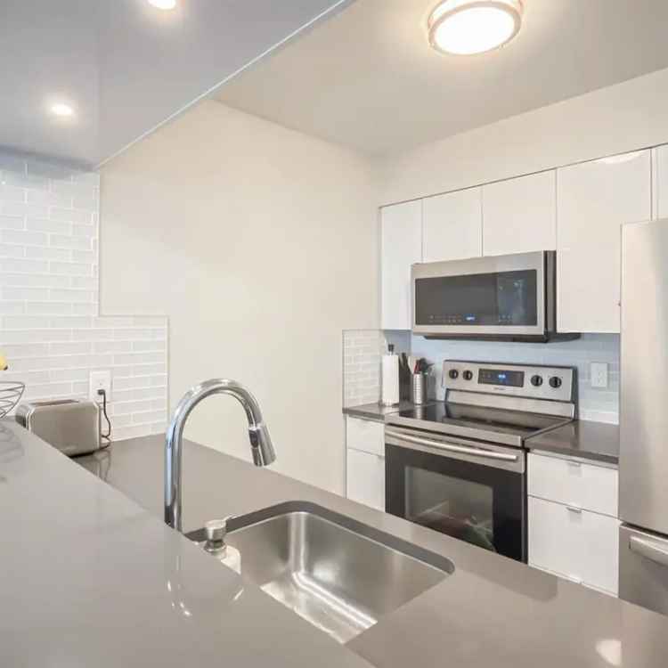 Updated Garden Level Corner Unit Near Lougheed Skytrain