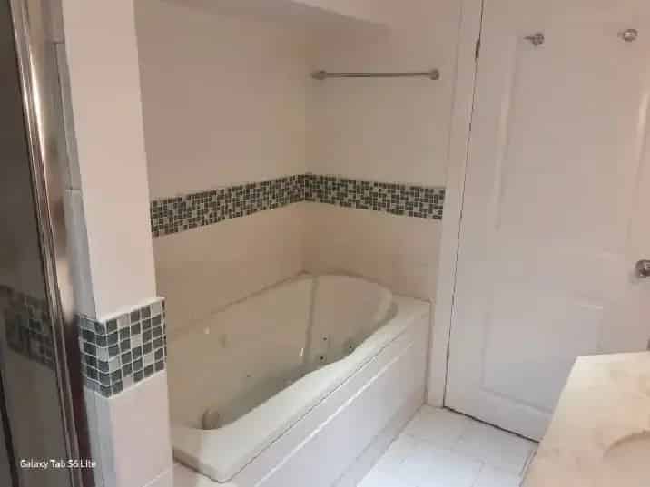 Spacious 2-Bedroom Den Basement Apartment Near Carlingwood Mall