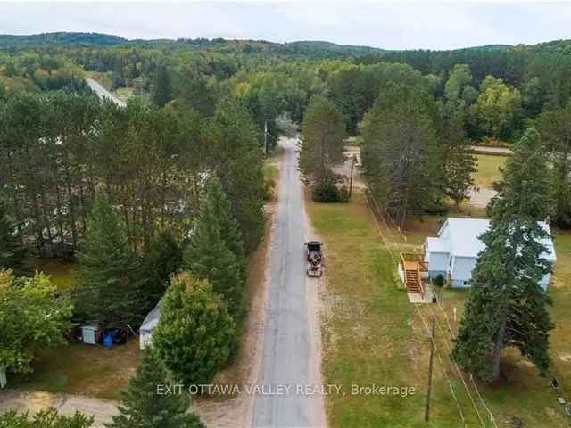 Lakefront Vacant Lot with Garage Near Boulter Lake