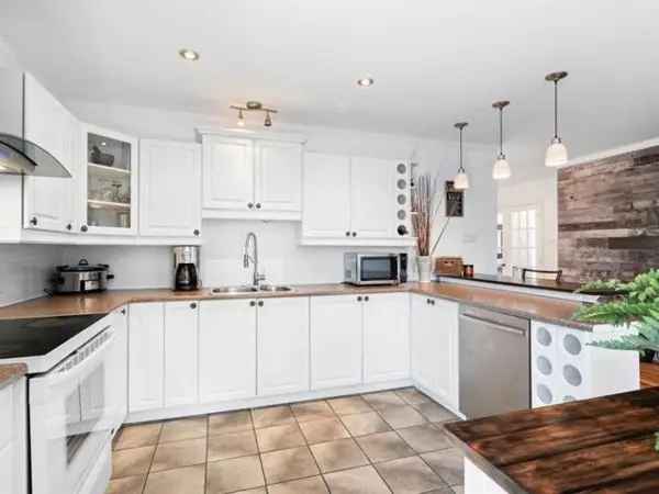 Bungalow for Sale in Saint-Colomban with Private Indoor Spa