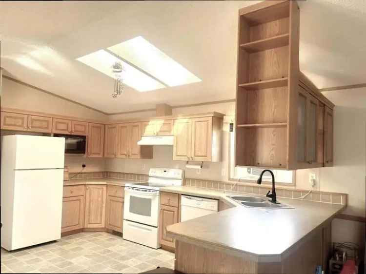 Buy Mobile Home in Edson with Private Setting and Modern Upgrades