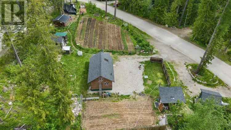 Century 21 Assurance Realty: 0.59 Acre Garden Lot with Cabin and Outbuildings