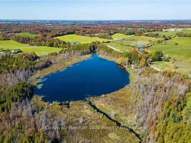 19 Acre Lakefront Property with Home and Workshop