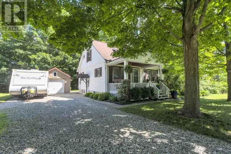 Charming 1.5 Storey Home on Ravine Lot