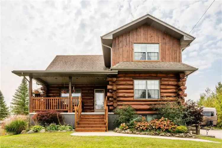 Custom built log home for sale in Southampton with expansive outdoor features