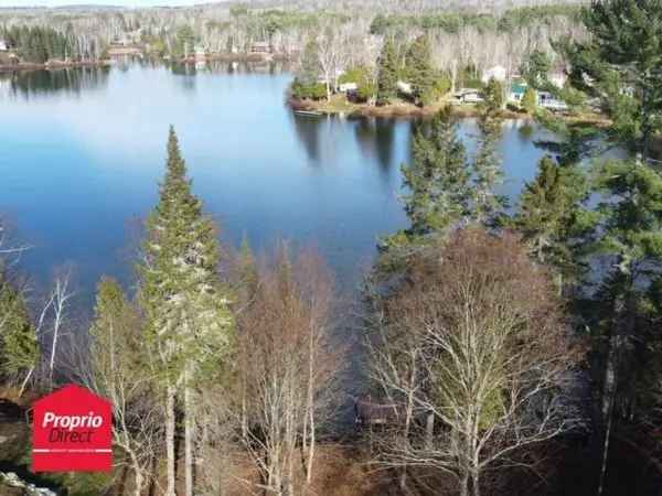 Lakefront Bungalow for Sale Laurentides 2 Acres Sandy Beach