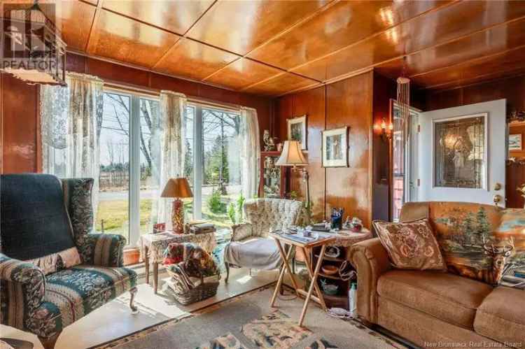 4-Bedroom Home on 2.98 Acres with Garages and Outbuildings