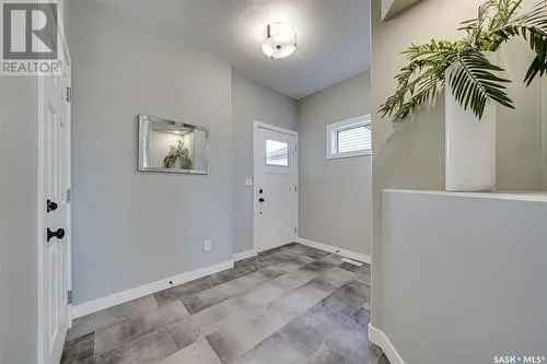 For Sale 4 Bedroom House in Rosewood Saskatoon with Bonus Room and Modern Features