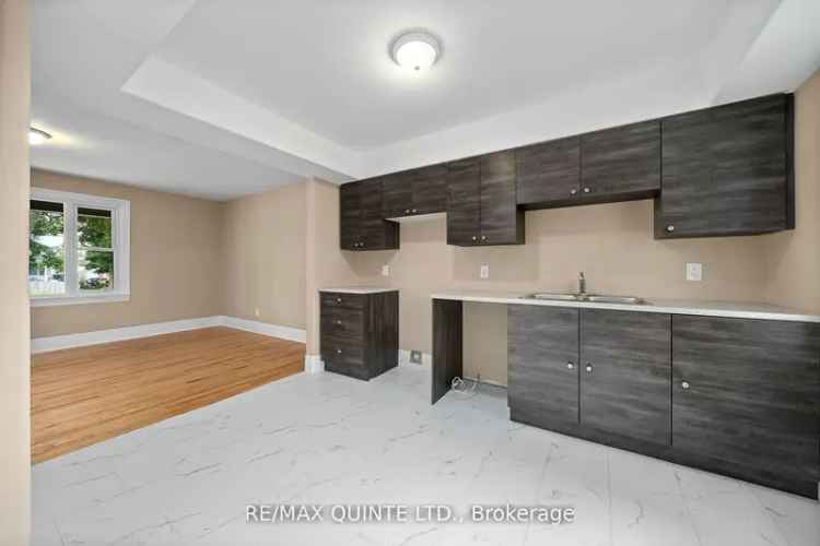 Buy home in Macaulay Village with spacious bedrooms and a renovated kitchen