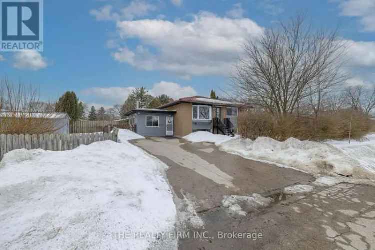 Buy raised bungalow in Huron Heights with sunroom and expansive yard